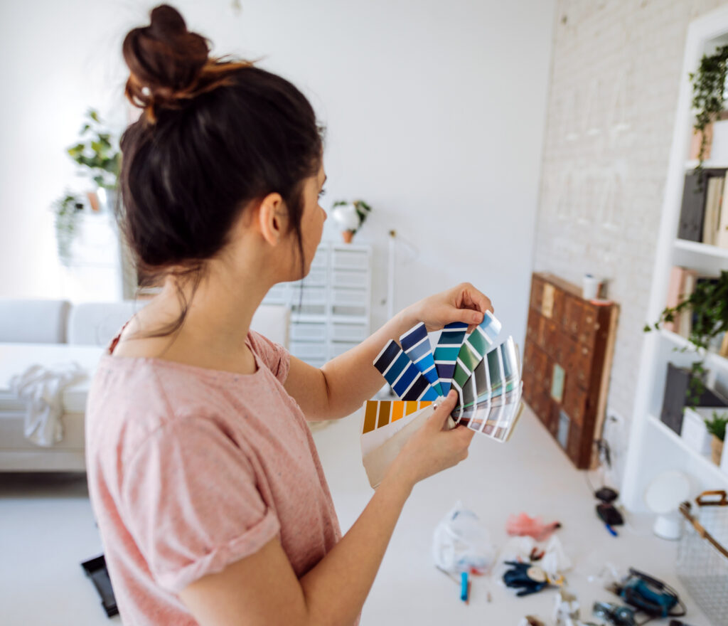 Women choosing paint color for her living room